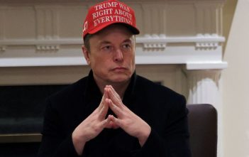 Elon Musk speaking at a press conference