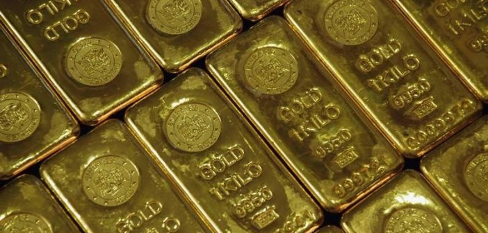 Gold bars representing record high prices amid economic tensions