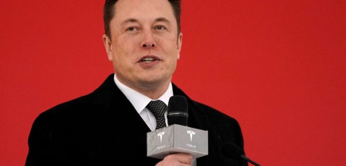 Tesla logo with a red alert symbol