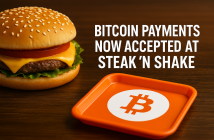 Bitcoin accepted sign in front of Steak ’n Shake restaurant