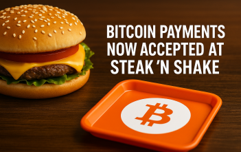 Bitcoin accepted sign in front of Steak ’n Shake restaurant