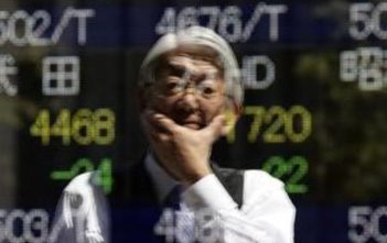 Asian stock traders analyze market trends in Tokyo and Sydney