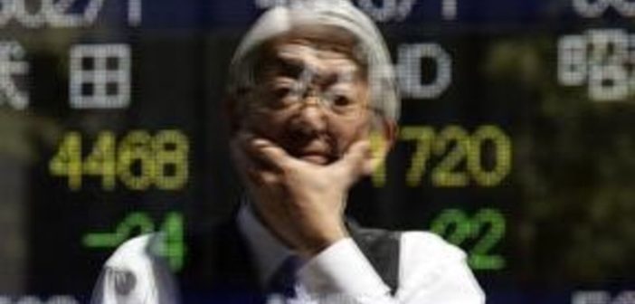Asian stock traders analyze market trends in Tokyo and Sydney