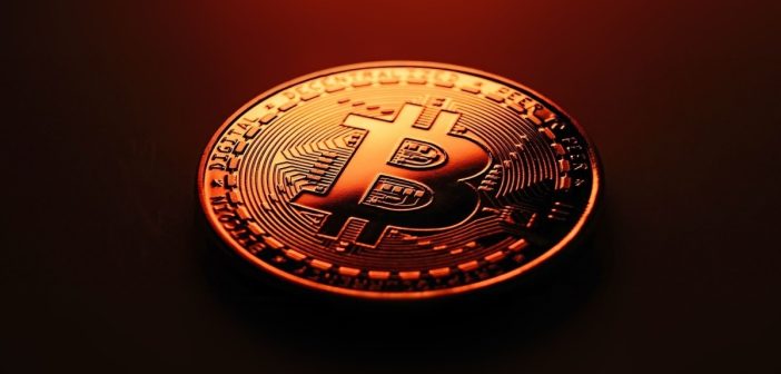 Bitcoin logo with upward chart and declining transaction icons
