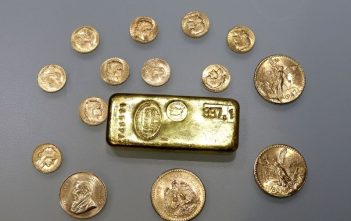 Gold bars representing rising prices amid market volatility