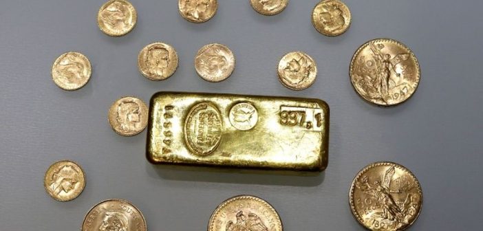 Gold bars representing rising prices amid market volatility