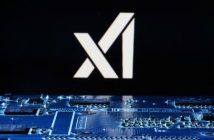 Elon Musk speaking at an event with xAI logo in the background