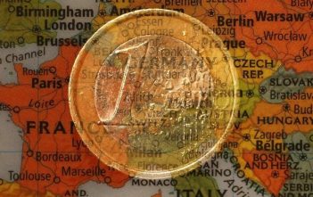 Euro symbol with global financial backdrop