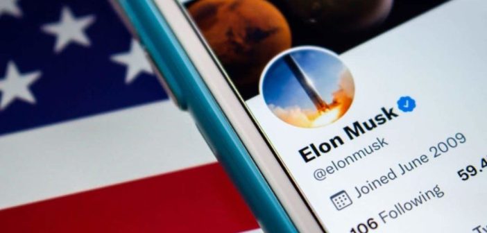 Elon Musk at podium with American flag and DOGE logo