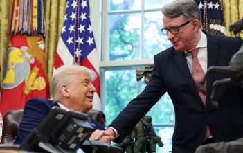 President Trump and Prime Minister Starmer shaking hands after signing the US-UK trade agreement