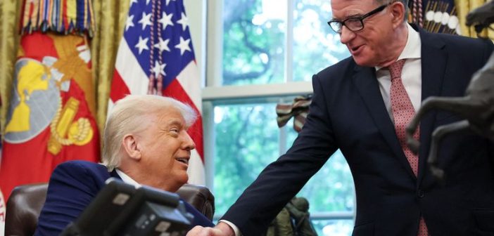President Trump and Prime Minister Starmer shaking hands after signing the US-UK trade agreement