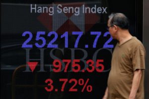 Traders monitor stock indices amid U.S.-China trade tensions