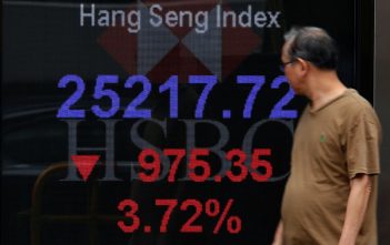Traders monitor stock indices amid U.S.-China trade tensions