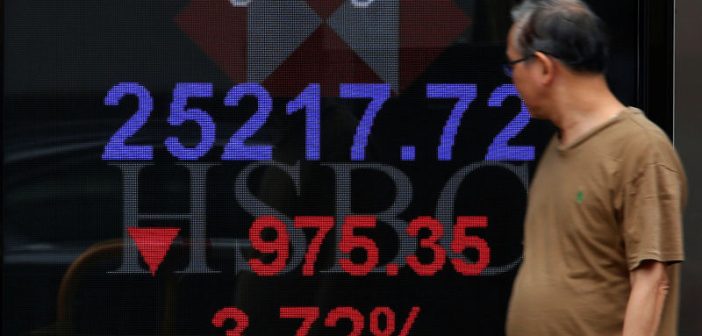 Traders monitor stock indices amid U.S.-China trade tensions
