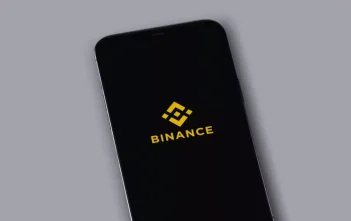Binance warning sign with crossed-out robot icon and Alpha Points badge