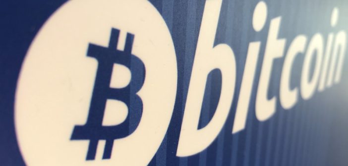 Bitcoin symbol with downward trend graph reflecting market decline