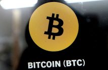 Bitcoin symbol with downward arrow and Middle East map representing price drop amid conflict