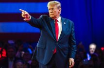 Donald Trump speaking on screen at Coinbase crypto event