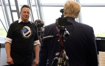 Elon Musk speaking at a press conference
