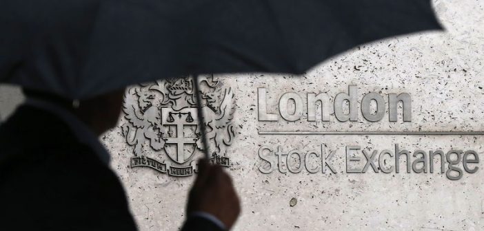 FTSE 100 stock chart with upward arrow, UK inflation and pound symbols