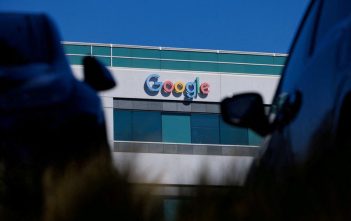Scales of justice with Google logo in EU courtroom setting