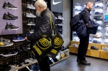 Logos of JD Sports, Adidas, and Puma with upward-trending stock charts
