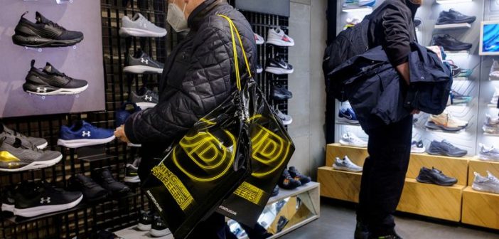 Logos of JD Sports, Adidas, and Puma with upward-trending stock charts