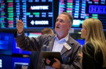 Traders monitoring financial markets amid geopolitical developments and Federal Reserve announcements