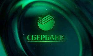 Sberbank headquarters with Bitcoin symbol and investment charts