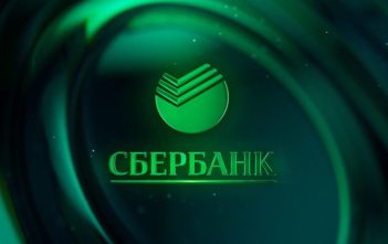 Sberbank headquarters with Bitcoin symbol and investment charts