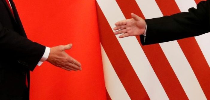 Flags of the United States and China with a handshake symbolizing the 2025 trade agreement