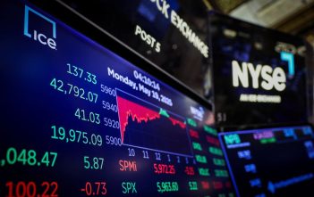 Stock market graph showing upward trend with Middle East map in the background