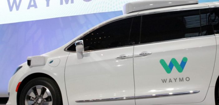 Damaged Waymo self-driving car on Los Angeles street during civil unrest